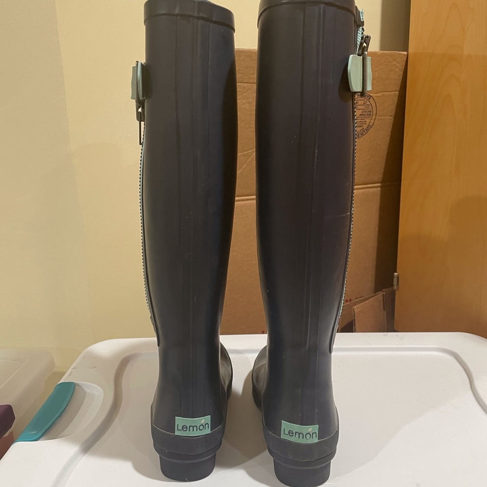 Knee high rain boots